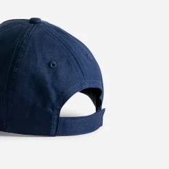 Casquette marine à visière ocre avec dino