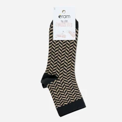 Chaussettes noires et or à motifs chevrons